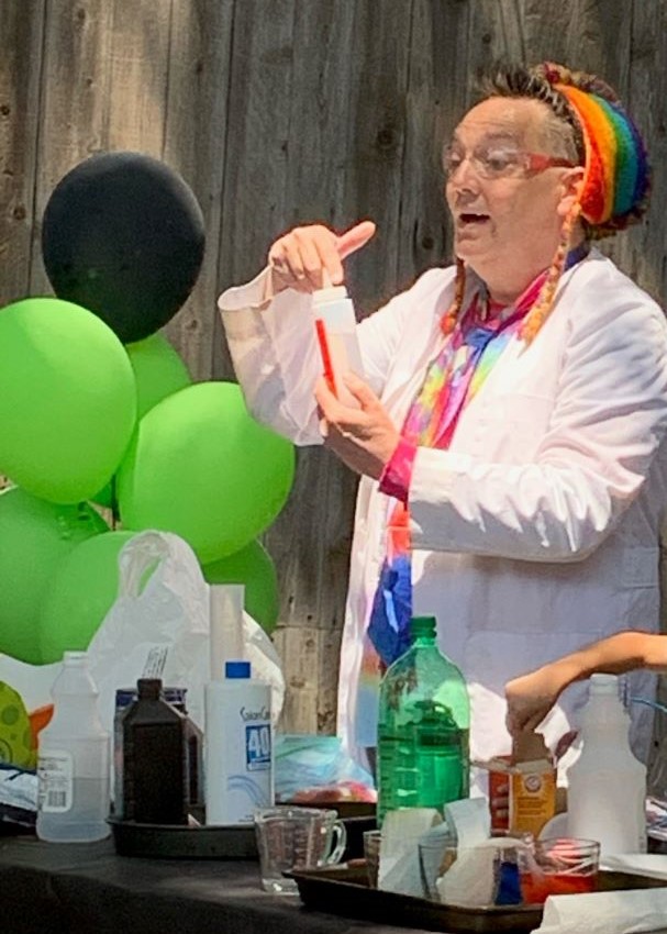 colorful mad scientist performing at a party